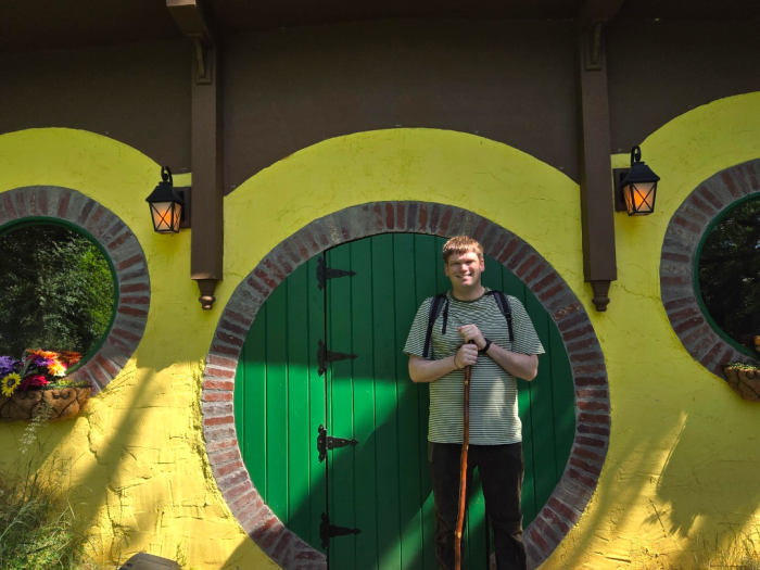 Jason Depudyt standing in front of a Hobbit inspired building. 
